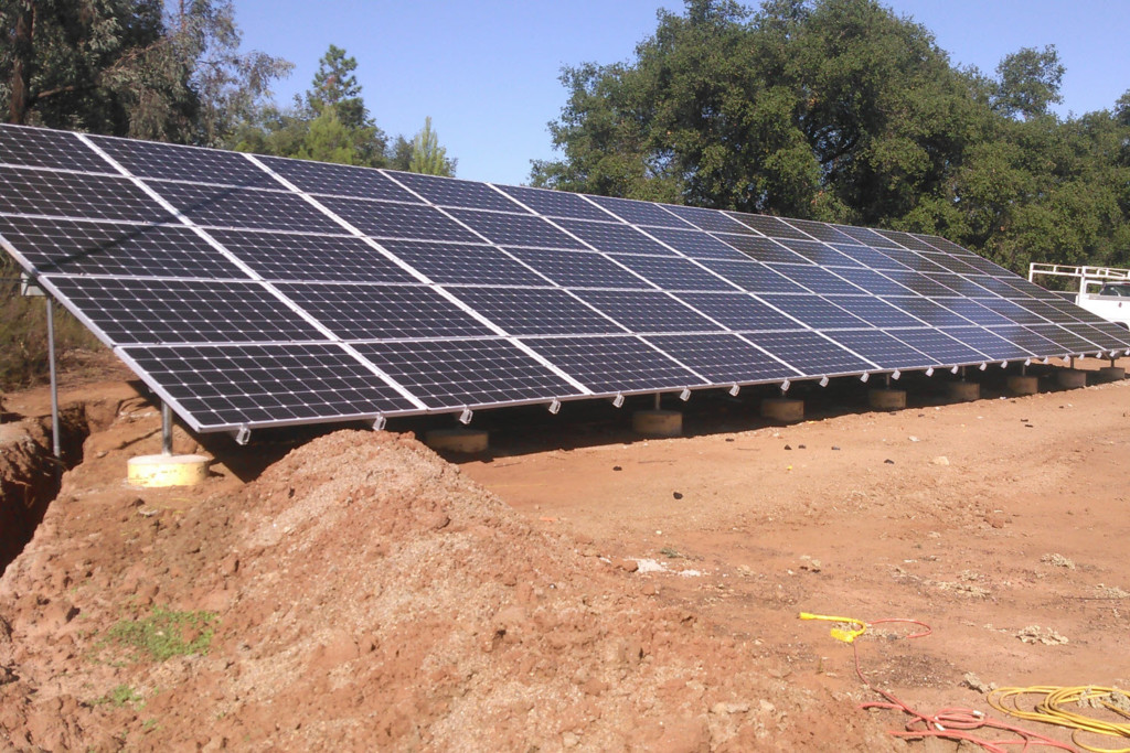 Ground Mount Solar Installation 1 A large solar array installed on a ground, harnessing solar energy for sustainable power generation.