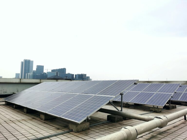 Solar panels installed on the roof of a modern building, harnessing renewable energy.