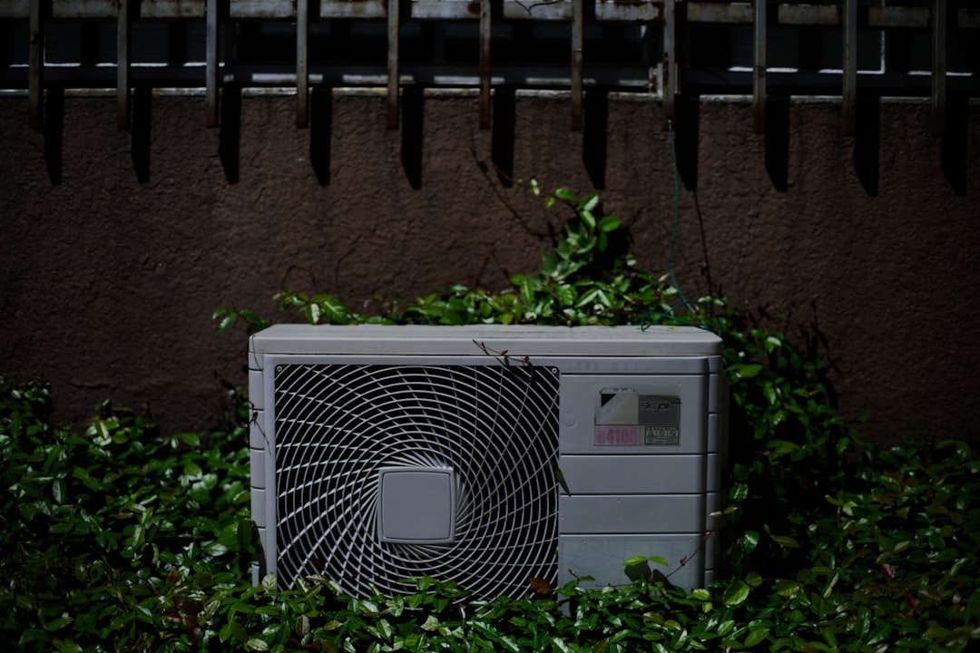 aging outdoor AC unit in a suburban San Diego backyard - signs your ac is nearing end of life