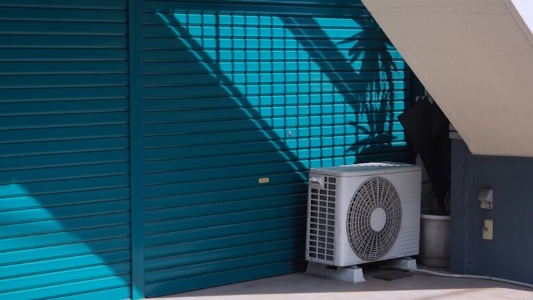 modern high efficiency outdoor AC condenser unit in a suburban backyard - average lifespan of modern high efficiency air