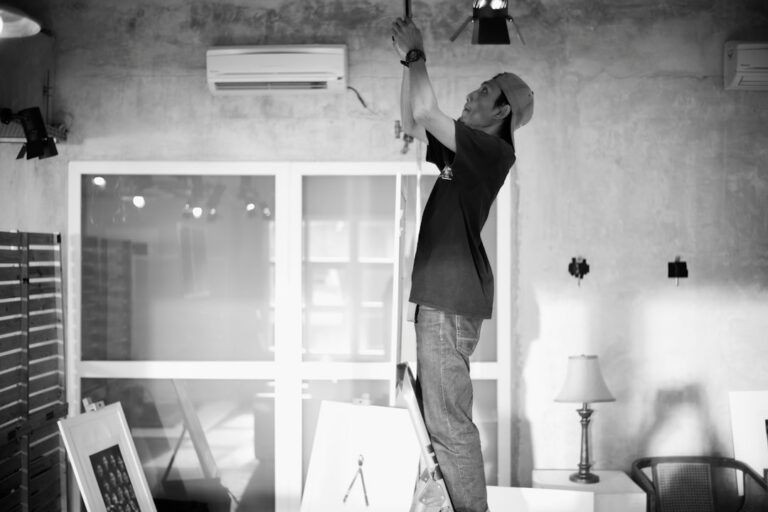 air conditioner tune-up technician performing AC maintenance check - best time of year to tune up your air conditioner