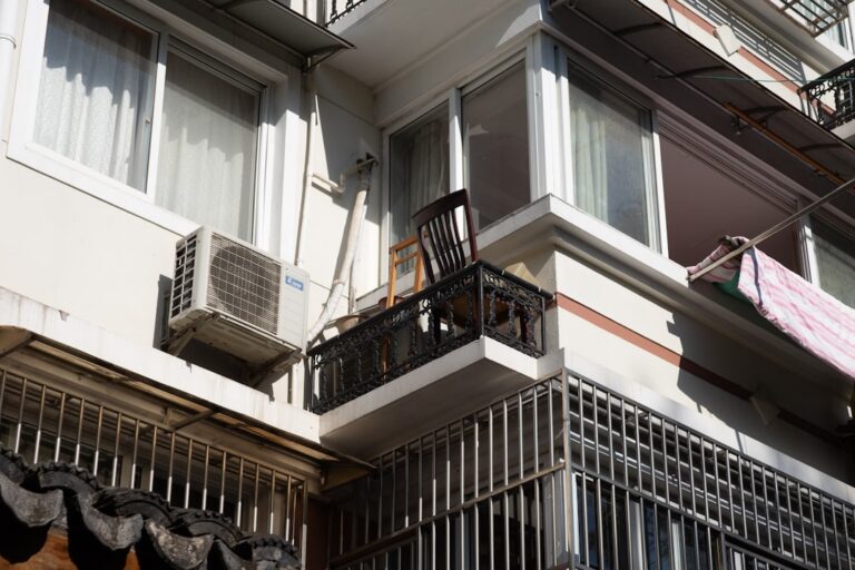residential AC unit outside a home during hot sunny afternoon peak heat hours - why does my ac shut off during peak heat