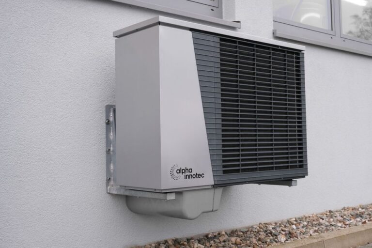 central air conditioning unit outside a San Diego suburban home in summer heat - how to keep your ac running efficiently all